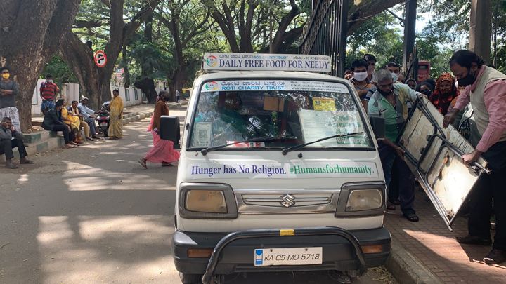 Chirag Indians volunteers distributing food packets to patients and families outside NIMHANS, Bengaluru