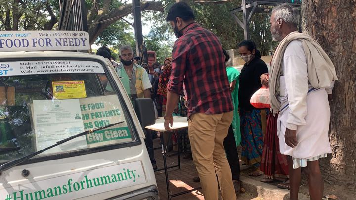 Chirag Indians volunteers distributing food packets to patients and families outside NIMHANS, Bengaluru