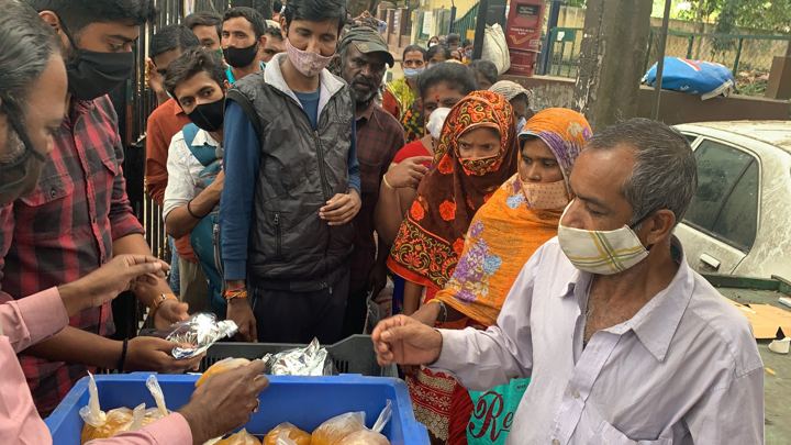 Chirag Indians volunteers distributing food packets to patients and families outside NIMHANS, Bengaluru