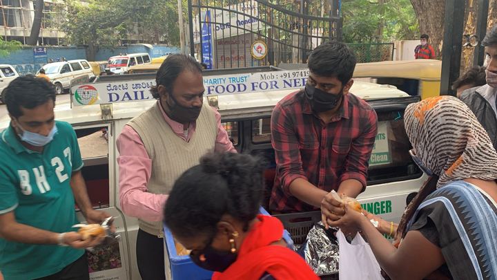 Chirag Indians volunteers distributing food packets to patients and families outside NIMHANS, Bengaluru