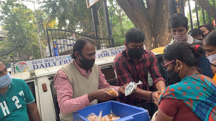Chirag Indians volunteers distributing food packets to patients and families outside NIMHANS, Bengaluru