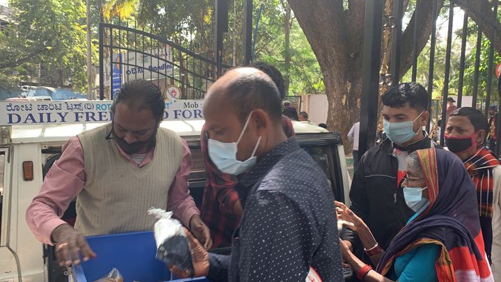 Chirag Indians volunteers distributing food packets to patients and families outside NIMHANS, Bengaluru