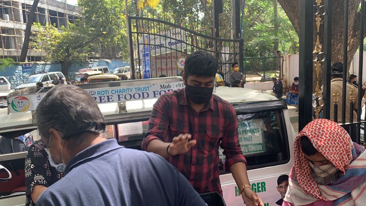 Chirag Indians volunteers distributing food packets to patients and families outside NIMHANS, Bengaluru