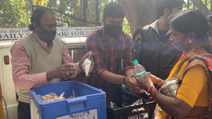 Chirag Indians volunteers distributing food packets to patients and families outside NIMHANS, Bengaluru