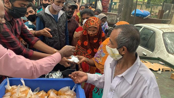 Chirag Indians volunteers distributing food packets to patients and families outside NIMHANS, Bengaluru