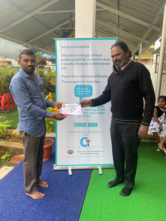 Students receiving certificates for pledging their eyes at a school awareness event