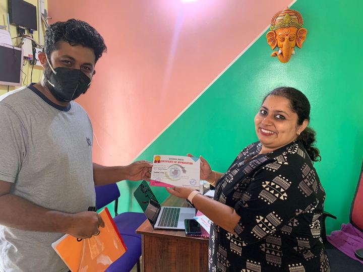 Students receiving certificates for pledging their eyes at a school awareness event